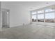 Well-lit room featuring large windows, perfect for a living or office space at 32497 N 135Th Dr, Peoria, AZ 85383