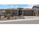 Charming single-story home with desert landscaping and a two-car garage at 32497 N 135Th Dr, Peoria, AZ 85383