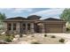 Inviting single story home with beautiful desert landscaping and a two car garage at 32497 N 135Th Dr, Peoria, AZ 85383