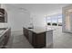 Gourmet kitchen island featuring stone countertop, stainless steel appliances, and ample storage at 32497 N 135Th Dr, Peoria, AZ 85383