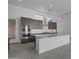 Modern kitchen with stainless appliances, kitchen island, and plenty of cabinet space at 32497 N 135Th Dr, Peoria, AZ 85383