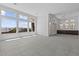 Bright, open living room with large windows offering scenic views and tile flooring at 32497 N 135Th Dr, Peoria, AZ 85383