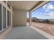Covered patio with view of the neighborhood, offering a perfect space for outdoor entertaining at 32497 N 135Th Dr, Peoria, AZ 85383