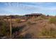 Scenic walking path leading to a community clubhouse and pool in a desert setting at 32497 N 135Th Dr, Peoria, AZ 85383
