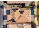 Aerial view of a home with a swimming pool, solar panels, and landscaped yard at 35756 N Clementine Trl, San Tan Valley, AZ 85140