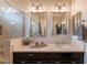 Bathroom showcasing double mirrors, a modern sink, and tiled shower at 35756 N Clementine Trl, San Tan Valley, AZ 85140