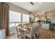 Dining room with modern lighting, large windows, and stylish decor provides a welcoming space at 35756 N Clementine Trl, San Tan Valley, AZ 85140