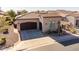 Charming single-story home with a tile roof, well-manicured landscaping, and a spacious driveway at 35756 N Clementine Trl, San Tan Valley, AZ 85140