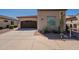 Charming single-story home with a two-car garage, desert landscaping and brown accents at 35756 N Clementine Trl, San Tan Valley, AZ 85140