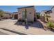 Attractive desert landscaping with a towering Saguaro cactus and beige house paint at 35756 N Clementine Trl, San Tan Valley, AZ 85140