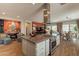 Modern kitchen with stainless steel appliances, gas cooktop and view into the living spaces at 35756 N Clementine Trl, San Tan Valley, AZ 85140