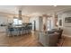 Open concept kitchen with large island, breakfast bar, stainless steel appliances and views to the living room at 35756 N Clementine Trl, San Tan Valley, AZ 85140