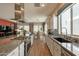 Open kitchen with granite countertops, stainless steel appliances, and a view into the living room at 35756 N Clementine Trl, San Tan Valley, AZ 85140