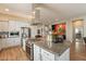 Modern kitchen featuring stainless steel appliances, granite countertops and white cabinetry at 35756 N Clementine Trl, San Tan Valley, AZ 85140
