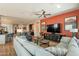 Open floor plan shows the spacious living room with a sectional sofa and view into the kitchen at 35756 N Clementine Trl, San Tan Valley, AZ 85140
