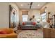 Relaxing living room features hardwood floors, a gray sofa and neutral paint colors at 35756 N Clementine Trl, San Tan Valley, AZ 85140