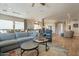 Spacious living room with an open floor plan, view of the kitchen, and cozy seating at 35756 N Clementine Trl, San Tan Valley, AZ 85140