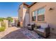 Comfortable outdoor patio with stylish seating and desert landscaping at 35756 N Clementine Trl, San Tan Valley, AZ 85140