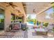 Inviting covered patio with lounge chairs, a ceiling fan, and views of the sparkling pool at 35756 N Clementine Trl, San Tan Valley, AZ 85140