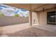 A large covered patio features brick pavers, a ceiling fan, and block wall at 4205 W Maggie Dr, San Tan Valley, AZ 85144