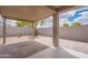 Covered back patio with brick pavers, landscaping, and a block wall at 4205 W Maggie Dr, San Tan Valley, AZ 85144