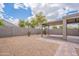 Large backyard featuring desert landscaping and a covered patio area at 4205 W Maggie Dr, San Tan Valley, AZ 85144