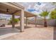 Paver patio extends to a covered sitting area overlooking desert landscaping at 4205 W Maggie Dr, San Tan Valley, AZ 85144