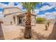Landscaped backyard featuring a covered patio, perfect for outdoor relaxation and entertaining at 4205 W Maggie Dr, San Tan Valley, AZ 85144