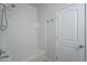 Bright bathroom featuring a bathtub with white tile surround at 4205 W Maggie Dr, San Tan Valley, AZ 85144