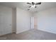 Neutral bedroom with ceiling fan and a doorway to another room at 4205 W Maggie Dr, San Tan Valley, AZ 85144