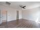Spacious bedroom with wood floors and a modern ceiling fan for added comfort at 4205 W Maggie Dr, San Tan Valley, AZ 85144