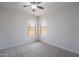 Well-lit bedroom featuring a ceiling fan and two windows at 4205 W Maggie Dr, San Tan Valley, AZ 85144