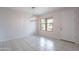 An open dining room with tile flooring and a modern chandelier at 4205 W Maggie Dr, San Tan Valley, AZ 85144