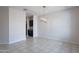 Dining area with tiled flooring and modern light fixture open to other rooms at 4205 W Maggie Dr, San Tan Valley, AZ 85144
