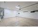 Two-car garage features epoxy floor, water heater, and access door at 4205 W Maggie Dr, San Tan Valley, AZ 85144