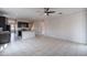 Expansive living room with open access to the kitchen, featuring tile floors and modern fixtures at 4205 W Maggie Dr, San Tan Valley, AZ 85144