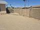 Fenced-in backyard featuring desert landscaping and a perimeter wall with gate at 5139 E Tano St, Phoenix, AZ 85044