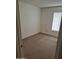 Bedroom with carpet, one window and fresh paint at 5139 E Tano St, Phoenix, AZ 85044