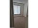 Bedroom with carpet, one window and fresh paint at 5139 E Tano St, Phoenix, AZ 85044