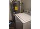 Laundry room with washer and water heater at 5139 E Tano St, Phoenix, AZ 85044