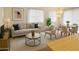 Tastefully decorated living room with large windows, neutral colors, and modern furniture at 5139 E Tano St, Phoenix, AZ 85044