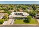 Expansive aerial view of home highlighting the rooftop pool, gray color scheme, and surrounding lush green neighborhood at 523 W Vista Ave, Phoenix, AZ 85021