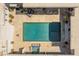 An aerial view of the pool, spa, and travertine decking showing the seamless transition between indoor and outdoor living at 523 W Vista Ave, Phoenix, AZ 85021