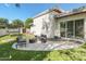 Modern backyard featuring a manicured lawn, seating area, fire pit, and a trampoline at 523 W Vista Ave, Phoenix, AZ 85021