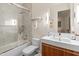 Contemporary bathroom featuring a glass enclosed shower, tub, and a modern vanity and sink at 523 W Vista Ave, Phoenix, AZ 85021