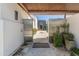 Welcoming entryway with mature landscaping, textured walls, and a view through to the refreshing pool area at 523 W Vista Ave, Phoenix, AZ 85021