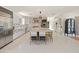 Spacious kitchen with stainless steel appliances, custom cabinets, marble counters, and an island with seating at 523 W Vista Ave, Phoenix, AZ 85021