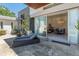 An outdoor lounge area with a chaise and an expansive sliding door that provides access to the living room at 523 W Vista Ave, Phoenix, AZ 85021