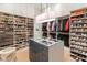 Expansive walk-in closet with custom shelving and a central island for accessories and storage at 523 W Vista Ave, Phoenix, AZ 85021