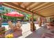 Backyard patio with a table, umbrella, and pool perfect for outdoor relaxation and entertainment at 5837 E Presidio Rd, Scottsdale, AZ 85254